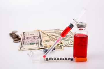 Money and drugs on white background