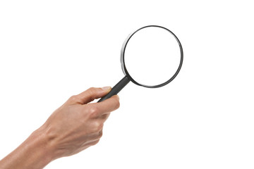 Hand holding a magnifying glass over white background.