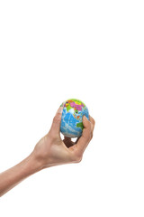 Globe in hand. Little planet earth being squeezed by a human hand. 