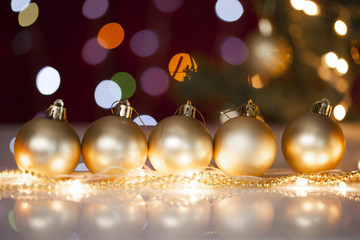 Gold Christmas decorations on light background 