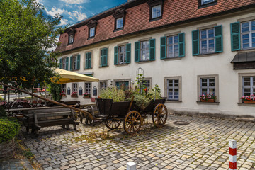 Bamberg. Old wagon in one of the courtyards of the old town.  Historic city center of Bamberg is a listed UNESCO world heritage site