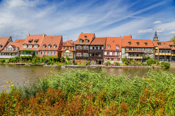 Fototapeta na wymiar Bamberg. View Little Venice - the former fishing village of the 17th century from the western bank of the Regnitz river. Historic city center of Bamberg is a listed UNESCO world heritage site