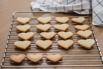 Heart shaped valentine's butter cookies cooling on the rack