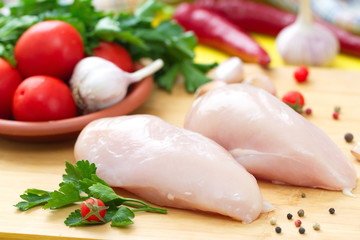 Raw chicken fillet with vegetables prepared for cooking