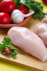 Raw chicken fillet with vegetables prepared for cooking