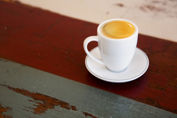cup of coffee on wooden table