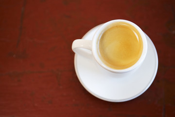 cup of coffee on wooden table