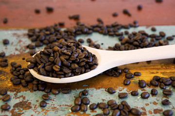 wooden spoon with coffee beans