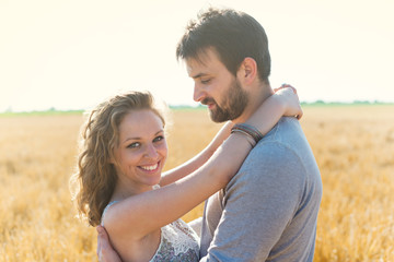 Happy Couple in Wheat Field