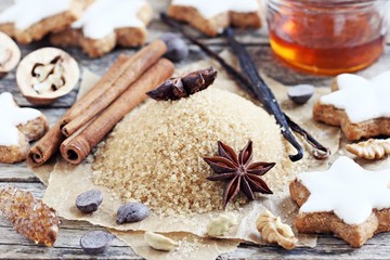 Traditional Christmas baking ingredients: spices, nuts, chocolate,honey. Toned image. Selective focus 