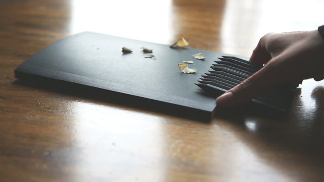 hands writing on copybook