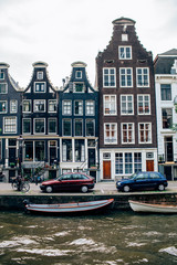 Naklejka premium AMSTERDAM NETHERLAND. Canal in Amsterdam has been called the Venice of the North for its more than 100 KM kilometers of canals, about 90 islands and 1,500 bridges
