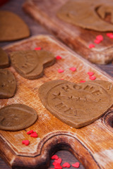 Heart shaped valentine gingerbread on a wooden board