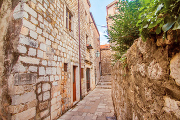 Narrow street and houses walls in the Old Town in Dubrovnik, Croatia 