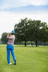 Young man playing golf