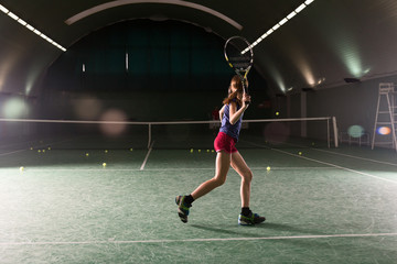 Young girl playing tennis