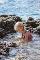 girl swimming in the sea cliff