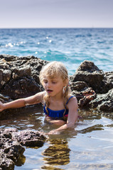 girl sitting in sea water