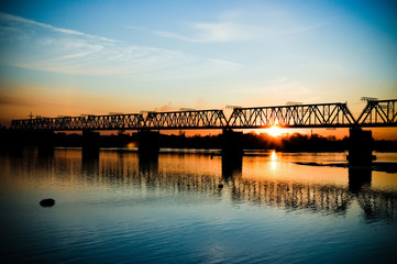 Bridge across the river at sunset