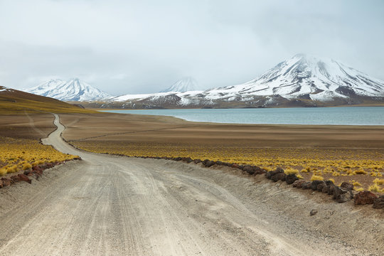 View of dirt road and Miscanti lagoon in Sico Pass