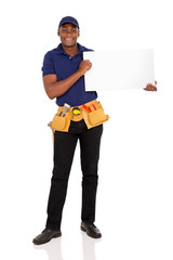 african repairman holding white board