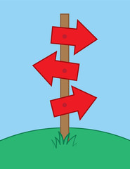 Multiple arrows sign post in grass
