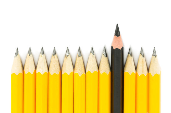 Yellow pencils with on black pencil on white background