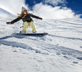Snowboarder moving down