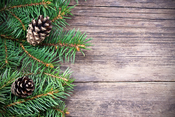 Christmas fir tree on a wooden background