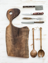 Kitchen-ware set. Old rustic chopping board made of walnut wood