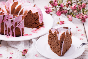 Chocolate cupcake with icing, herbarium of dried roses.selective focus
