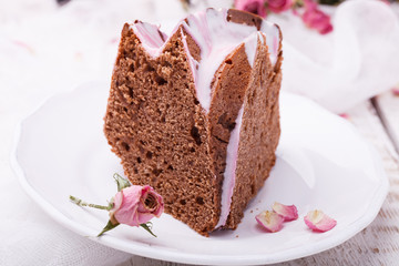 Chocolate cupcake with icing, herbarium of dried roses.selective focus
