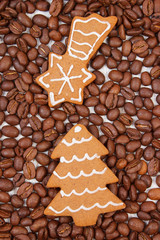 Fresh baked decorated gingerbread and coffee grains, christmas time
