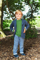 Outdoor portrait of a cute little boy of 4 years old