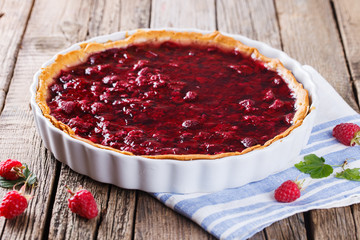 Tart with fresh raspberries in jelly fill.selective focus