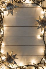 Christmas lights on wooden background
