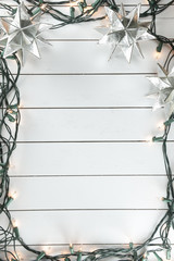 Christmas lights on wooden background
