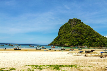 Mountain and fishing boat