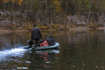 Fototapeta na wymiar hunters on the river