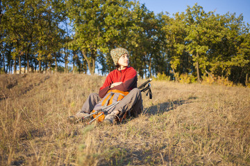 Young girl sitting on the grass.