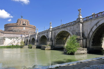 Fototapeta na wymiar Castel Sant'Angelo and arches of the bridge across the river