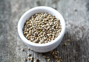 hemp seeds on wooden surface