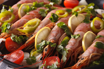 large shrimp with lemon and vegetables macro. horizontal