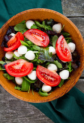 fresh salad in a wooden bowl