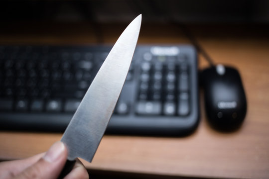 Knife With Mouse In Dark Tone,computer Online Or Social Network Killer Murder Concept