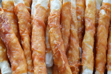 dog snack chicken roll on stainless weighting scale tray