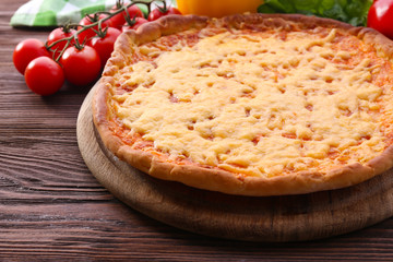 Cheese pizza with vegetables on table close up