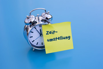 alarm clock with german word 'Zeitumstellung' (time change)