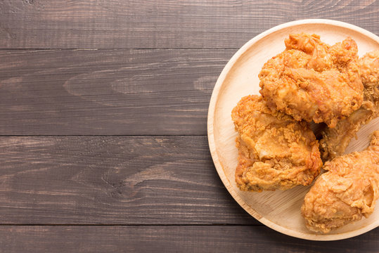 Fried mixed chicken on a wooden background