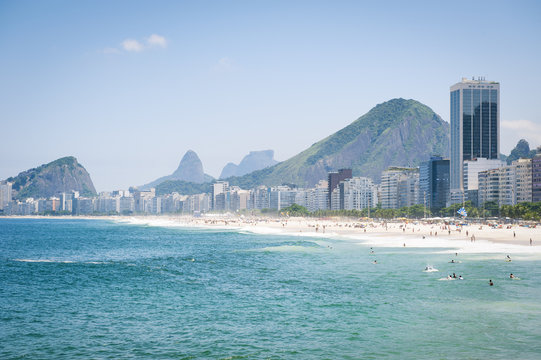 Scenic view of Copacabana Beach shore from the Leme end with skyline of Rio de Janeiro Brazil